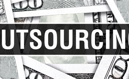 Black and white money with the word outsourced on it